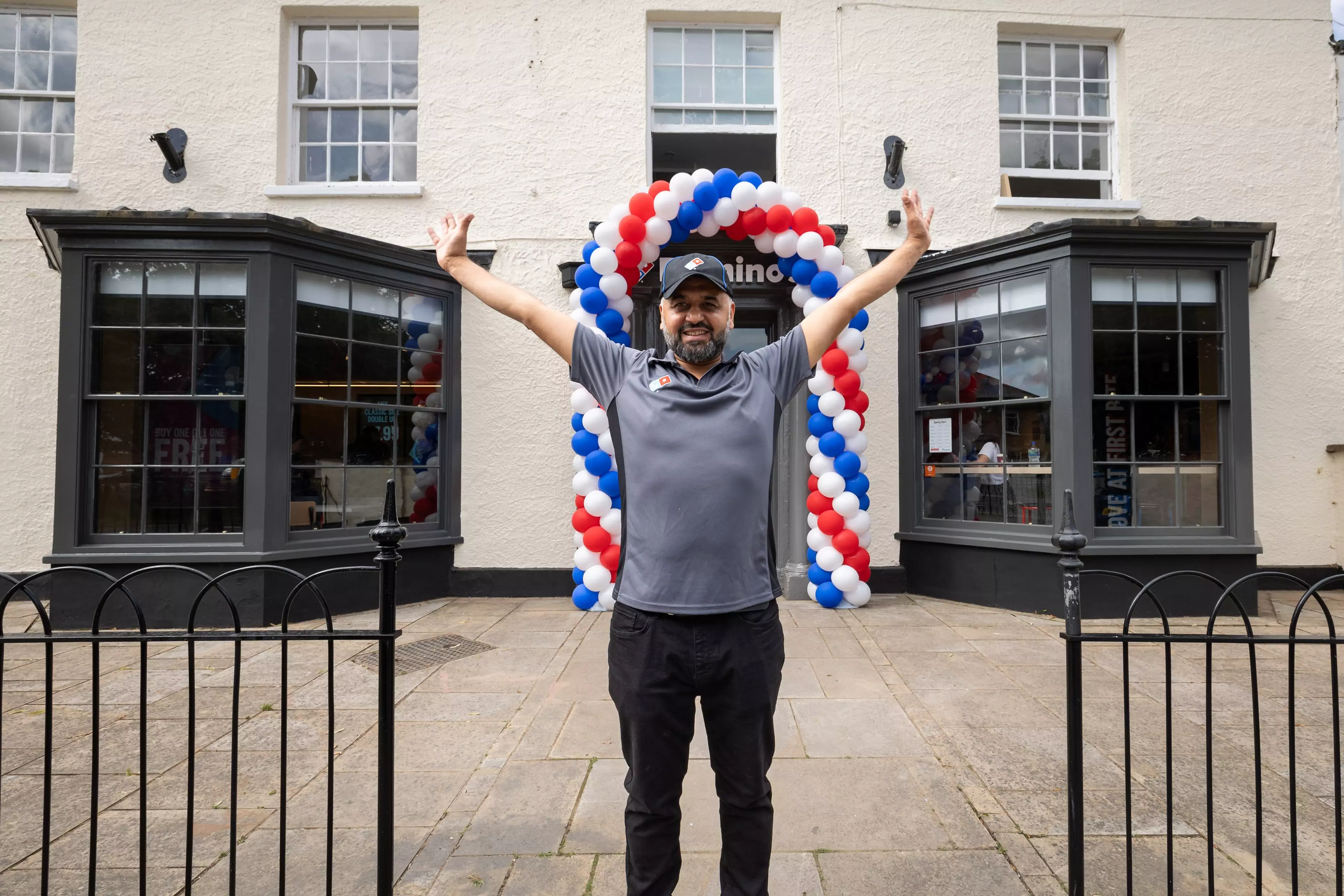 Ali Amir in front of his new store